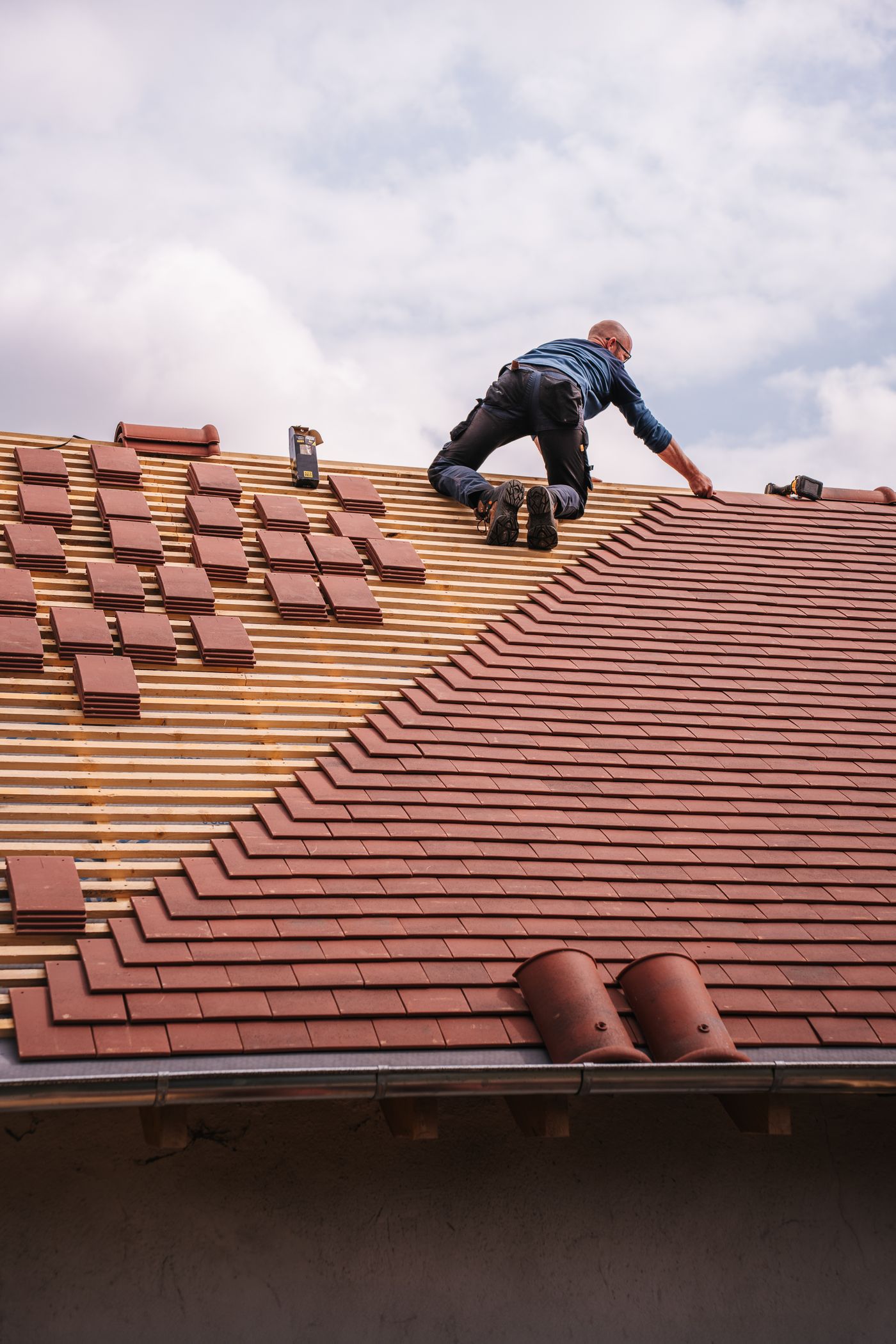 Roofer completing careful work on a residential roof